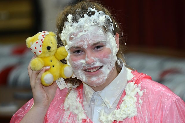 Arianna Cheesebrough smiling with her Pudsey after getting a custard pie in the face in aid of the English Martyrs School and Sixth Form Children In Need event.