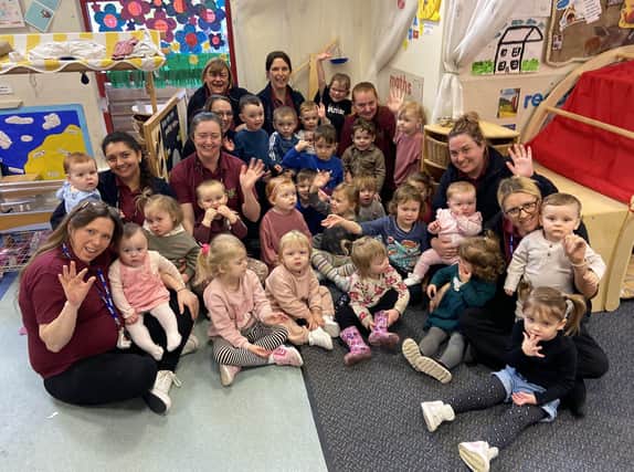 Kiddikins Nursery staff and children celebrate their 'outstanding' Ofsted grade.