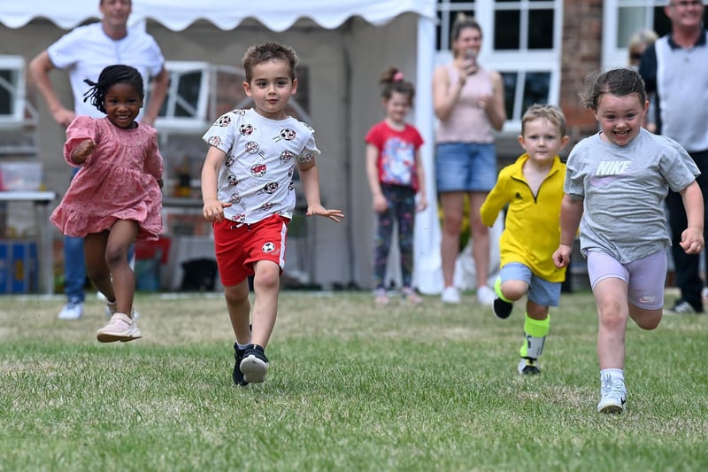 Jahzara Esther Fleet, left, and Jack Innes, second left, with their friends competing in a race at the Greatham Feast picnic. Picture by FRANK REID