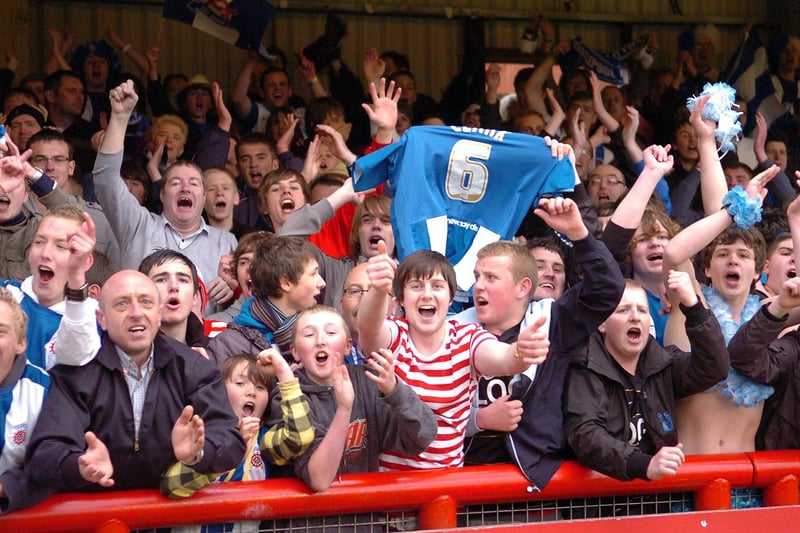 A lone Where's Wally fan celebrates as Pools stay up at Brentford on the final day of the 2009-10 season.