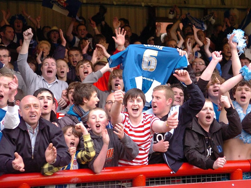 A lone Where's Wally fan celebrates as Pools stay up at Brentford on the final day of the 2009-10 season.