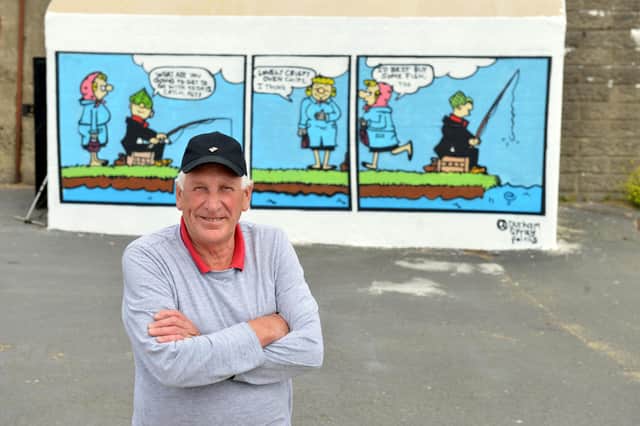 The Andy Capp mural has been painted on Derek Harrison's Headland building as a birthday present from his wife.