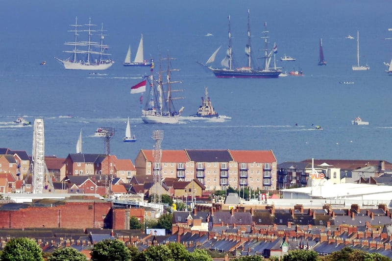 Tall Ships vessels sail out into the North Sea as part of the Parade of Sail.