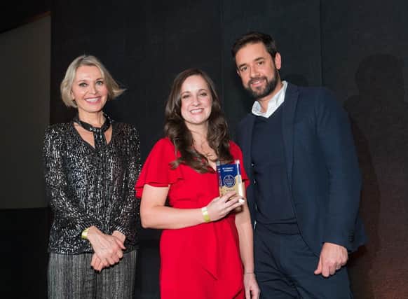 Nikki Bedi, left, and Adam Huttly from Red-Inc, right, present the award for Best Community Contribution to Tilly Bailey & Irvine Solicitors collected by Jessica Morton, centre.
