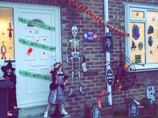 Lola, age 4, looks right at home at this haunted house. She's much braver than we are!