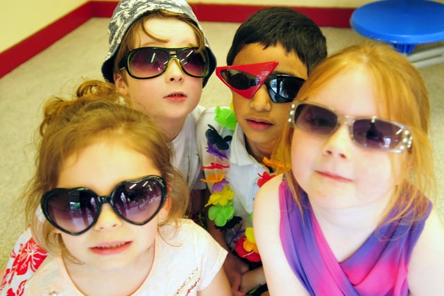 Key stage one pupils Finley Mulgrew, Jawaad Shah, Jennarose Francis and Holly Webb dress up in their best summer clothes in 2014.