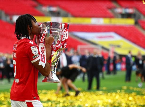 Djed Spence of Nottingham Forest kisses the trophy following their sides victory in the Sky Bet Championship Play-Off Final match between Huddersfield Town and Nottingham Forest. (Photo by Christopher Lee/Getty Images).