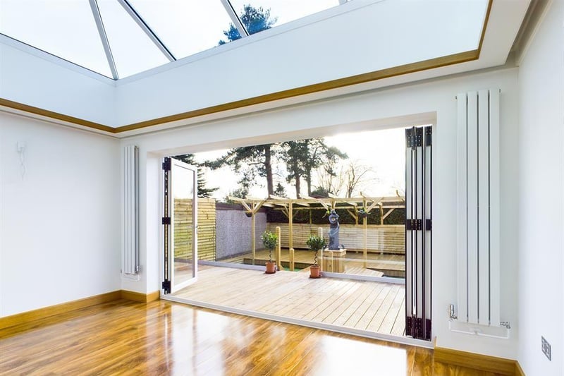 Tri-folding doors from the Orangery extension to the rear garden.