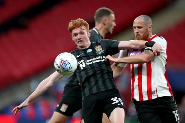 New Hartlepool United signing Tom Parkes, right, battles with Northampton Town's Callum Morton while playing for Exeter City in the Sky Bet League Two play-off final match at Wembley in 2020.