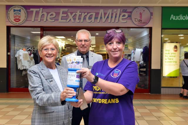 Councillor Brenda Loynes along with consort Dennis Loynes handing over funds to Michelle Shield from Miles For Men.