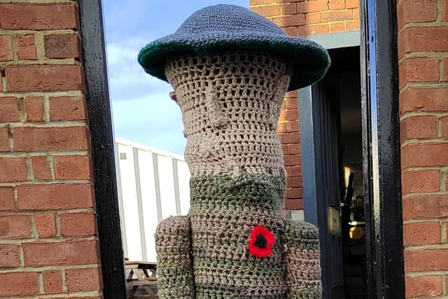 Soldier gate guardian knitted by the Heugh Yarners.