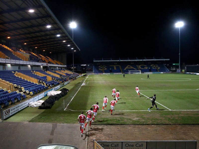 Cheltenham Town players run out alone to face the Stage, who are changing in a diferent stand.