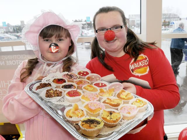 Caitlin Groves and Lauren Allison(right) pictured with some of the cakes at their stall in the Belle Vue Way Tesco store. Remember this from nine years ago and who can tell us more about the occasion?