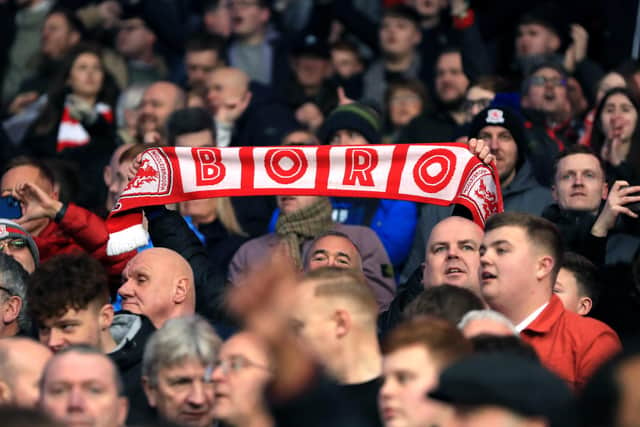 Middlesbrough fans in the stands celebrate.