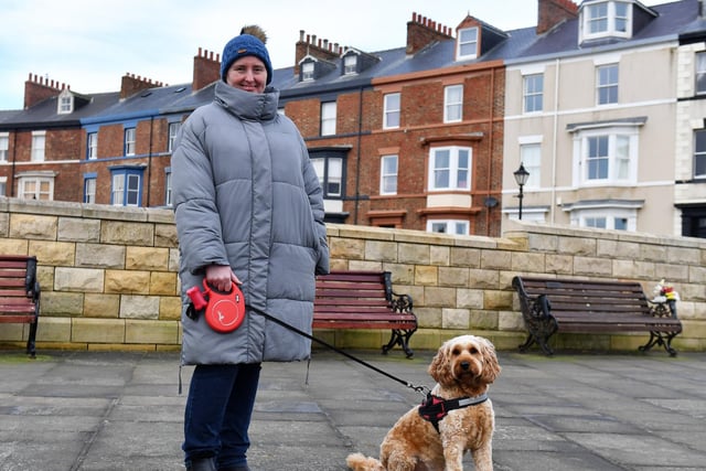 Kay Thompson takes her dog Cecil out for a walk.