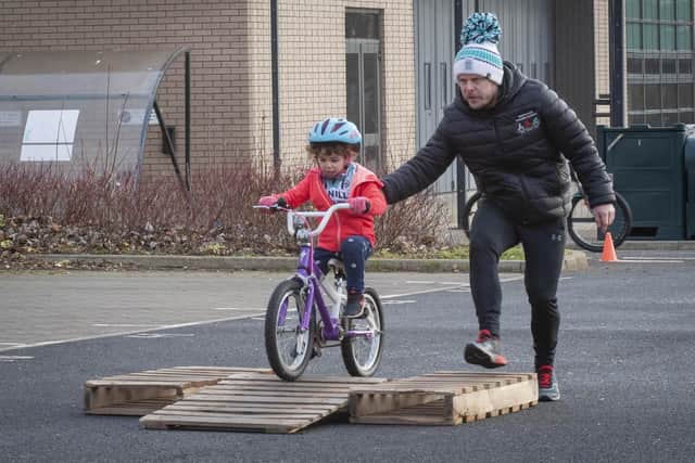 Adam Brooks, Manilla Cycling Coach, with his daughter, Sienna Lilly Brooks (5).