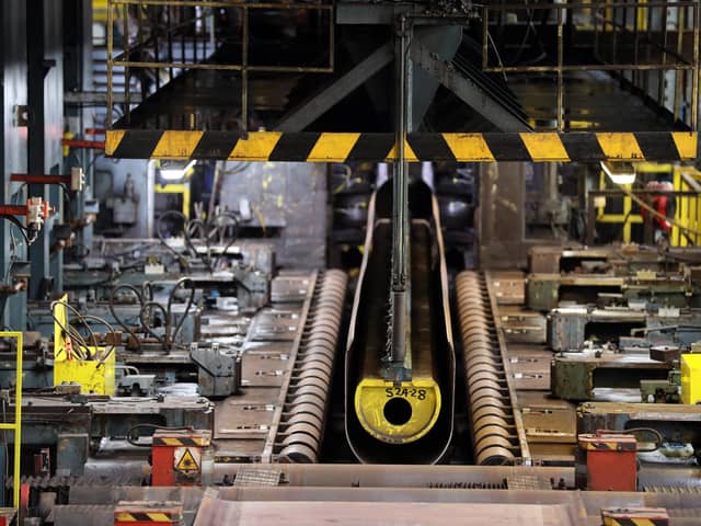 A steel sheet is bent in to a 'U' shape before being turned into a pipe at Liberty Steel's mill in Hartlepool. Photographer: Chris Ratcliffe/Bloomberg.