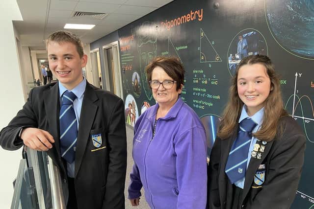 Janice Forbes from Alice House Hospice in Hartlepool at High Tunstall College of Science with students Oliver Huermann and Isobel Huermann after being presented with a cheque for £7,000. Picture by FRANK REID