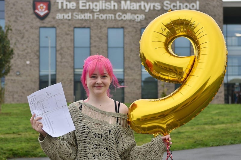 Ava collects her GCSE results from English Martyrs.