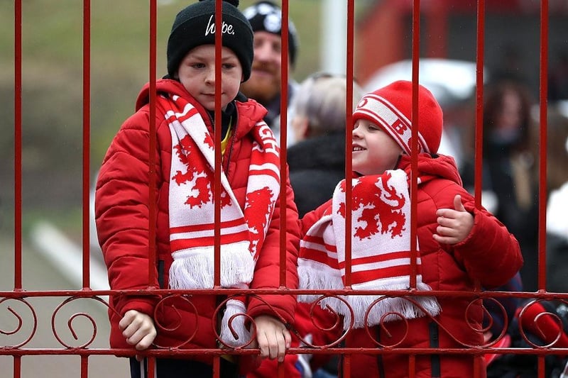 Two Middlesbrough fans wait outside the gates at the stadium prior to the Premier League match between Middlesbrough and West Ham United at the Riverside Stadium on January 21, 2017.