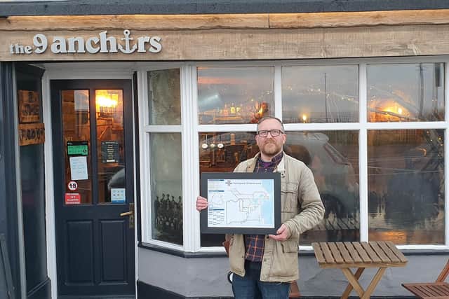 Steve Lovell with a copy of his map outside the 9 Anchors, in Seaton Carew.