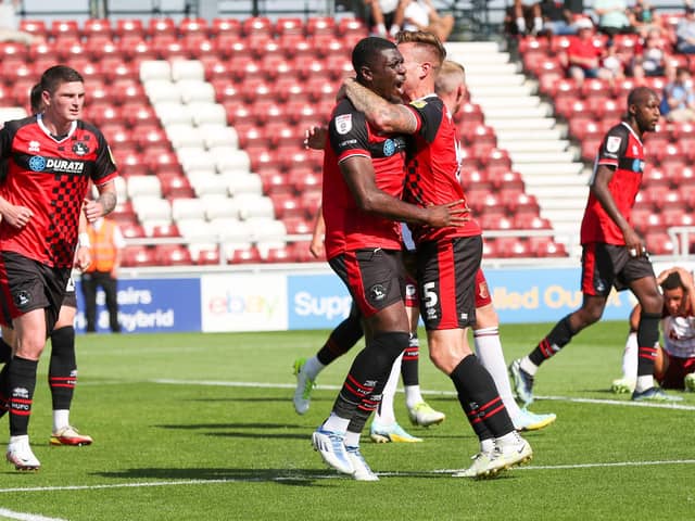 Josh Umerah celebrates with team mates after scoring for Hartlepool United against Northampton Town. (Credit: John Cripps | MI News)