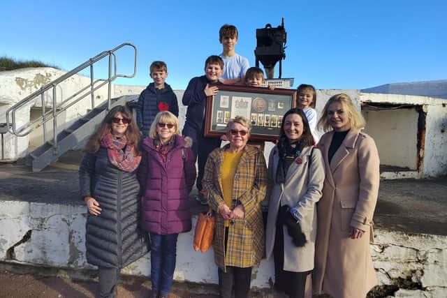 Relatives of Bombadier JJ Hope visiting the Heugh Gun Battery with his medals and citation from the King.