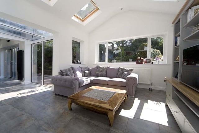 The sunny family room makes the most of the beautiful views of the garden.