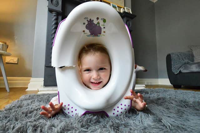 Clodagh-Mae Cafferkey with her toilet trainer.  Picture by FRANK REID.
