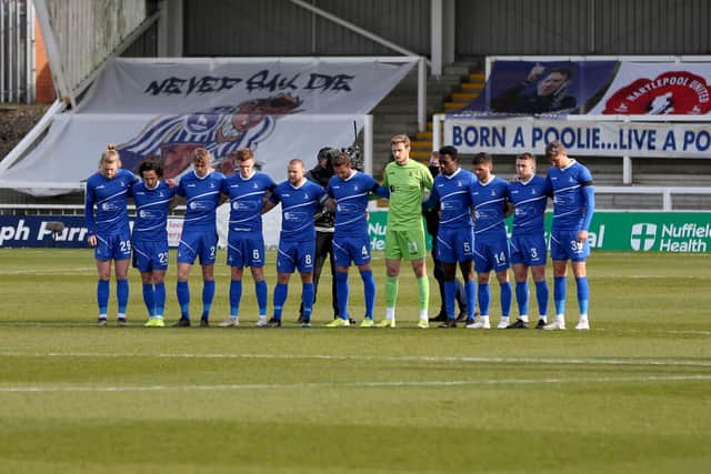 The Hartlepool players mark the death of HRH Price Philip during the Vanarama National League match between Hartlepool United and Notts County at Victoria Park, Hartlepool on Saturday 10th April 2021. (Credit: Chris Booth | MI News)