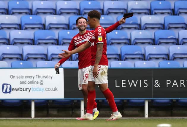 Patrick Roberts and Marcus Tavernier celebrate Middlesbrough's winner against Reading.