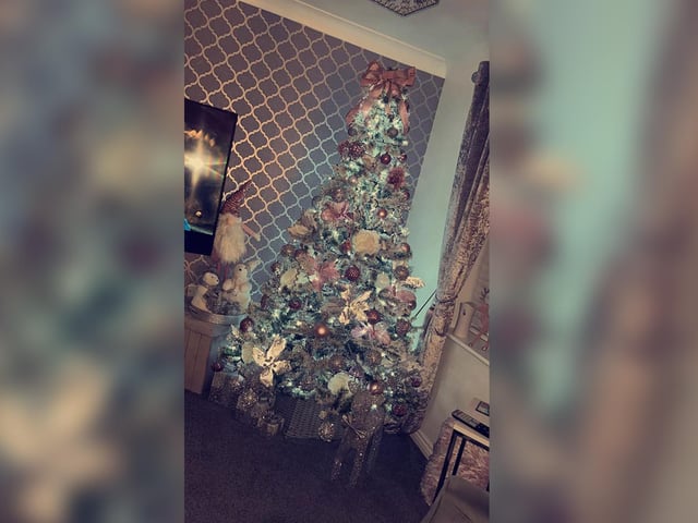 A bow is the finishing touch to this tremendous tree.