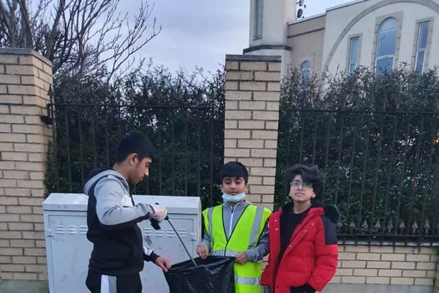 Youngsters did their bit to clean up the area.