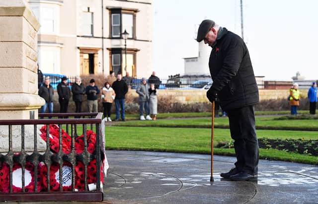 A member of the public pays his respect during the Bombardment of the Hartlepools memorial service.