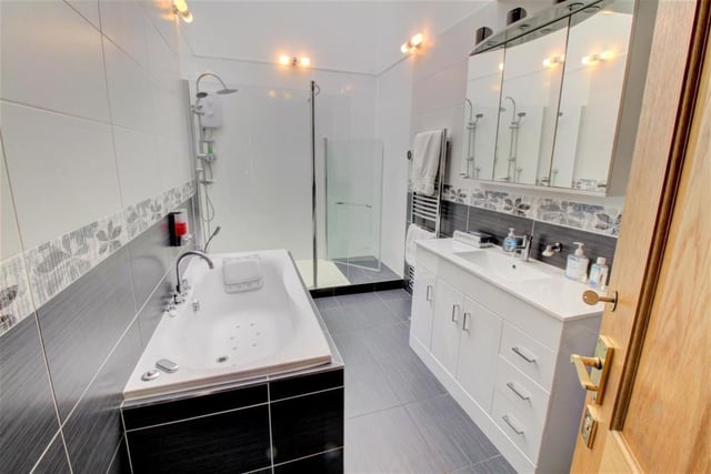 The bathroom is particularly spacious with a slimline shower cubicle and a stylish whirlpool bath.