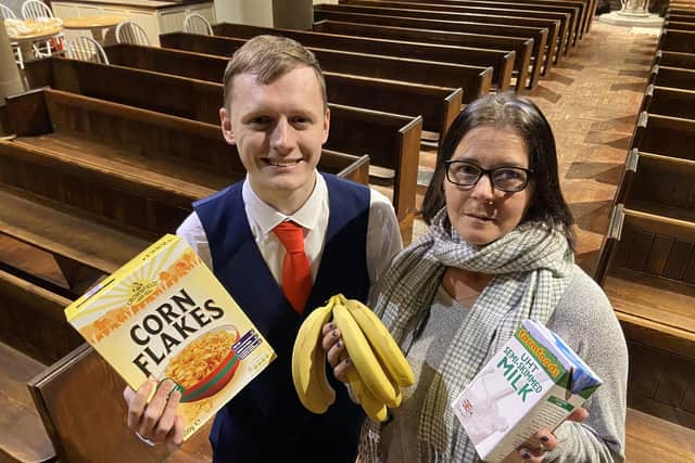 Councillor Cameron Sharp with Claire Barker, food store manager at St Aidan's Soup Kitchen holding some of the items donated to the food bank ahead of the fundraising night. Picture by FRANK REID