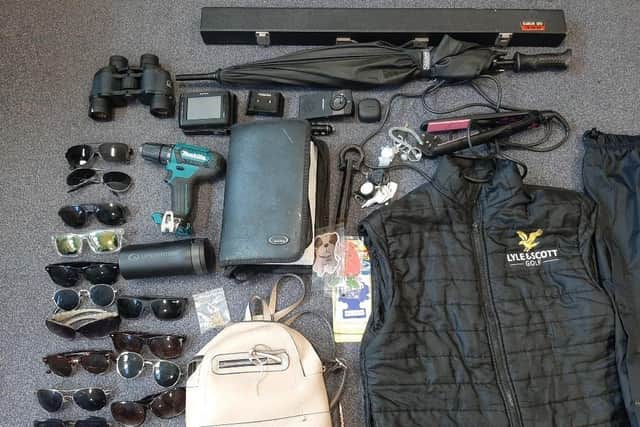 Some of the items which were recovered after a woman was arrested in connection with thefts from cars.