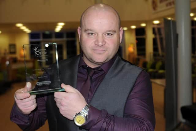 Micky with the Best of Hartlepool fundraiser of the year award he won in 2013.