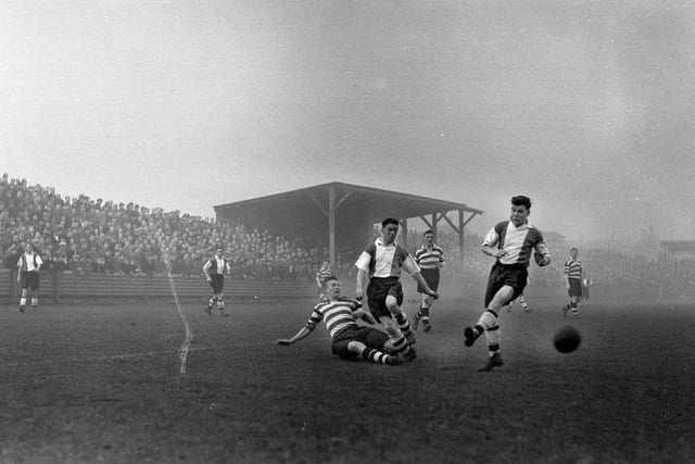 Hartlepool United's Tommy Mc Guigan and Eric Wildon action against derby rivals Darlington during a match at the Victoria Ground before a crowd of over 10,000 in January 1955. The match ended in a 2-2 draw with pools winning the replay at the Feethams ground by 2-0.