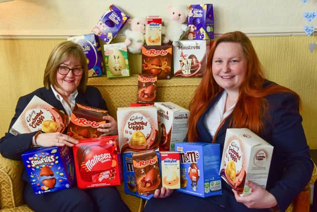 Funeral Service managers Julia Masshedar (left) and Corina Callan at Mason's Funeral Directors with some of the Easter eggs collected so far.