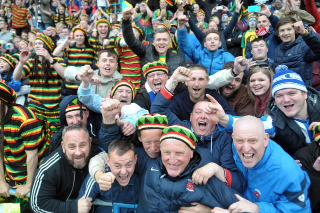 Pools manager Ronnie Moore with a group of Hartlepool United fans dressed in reggae gear at the final game of the season away to Carlisle United.