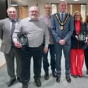 Councillor Shane Moore and Ceremonial Mayor presents the Mayor's Award to three members of the public.