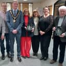 Councillor Shane Moore and Ceremonial Mayor presents the Mayor's Award to three members of the public.