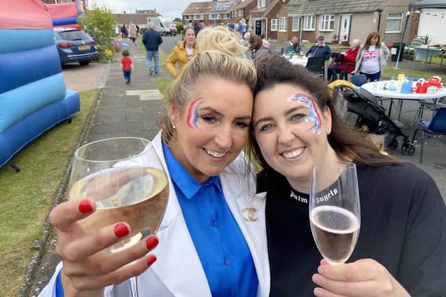 Tracy Garthwaite (left) and Jess Tait raise a glass during the Queen's Jubilee celebrations on Trentbrooke Avenue, Hartlepool. Picture by FRANk REID