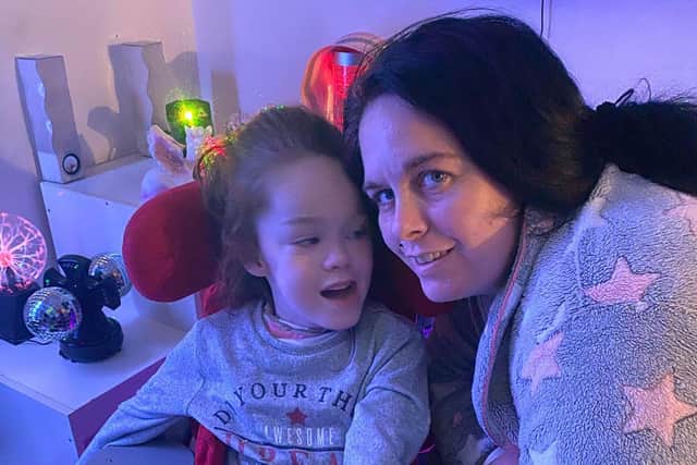 Tilly with mum Samantha Malone in her sensory room.