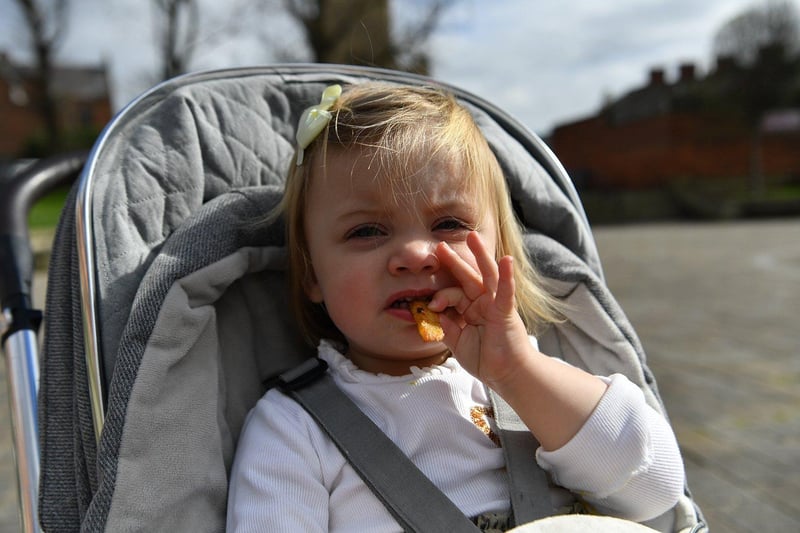 Young Hattie Davis-Stokes enjoys a snack on the Headland.