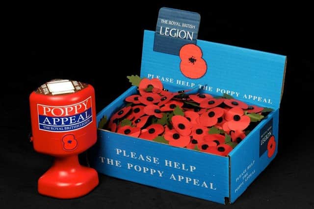 A poppy appeal collection tin and box.