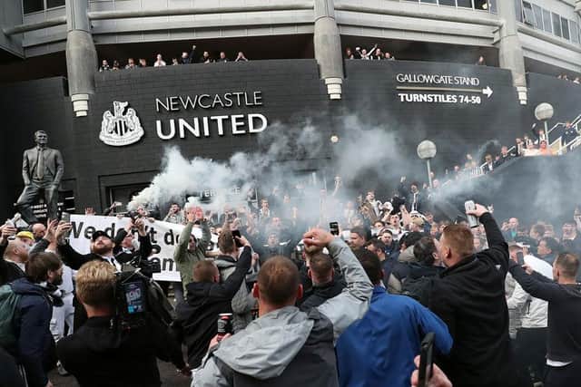 Newcastle United supporters celebrate outside the club's stadium St James' Park in Newcastle upon Tyne in northeast England on October 7, 2021, after the sale of the football club to a Saudi-led consortium was confirmed. (Photo by -/AFP via Getty Images)