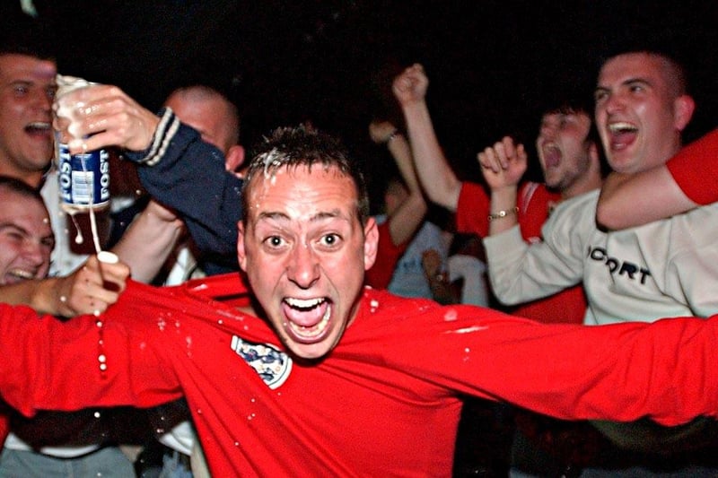 England fans celebrate in Hartlepool's Sports Bar as the side score against Portugal during Euro 2004.