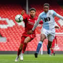 Rhian Brewster of Liverpool and Tyler Magloire of Blackburn Rovers in action during the PL2 match at Anfield on April 28, 2019 in Liverpool, England. (Photo by Nick Taylor/Liverpool FC/Liverpool FC via Getty Images)